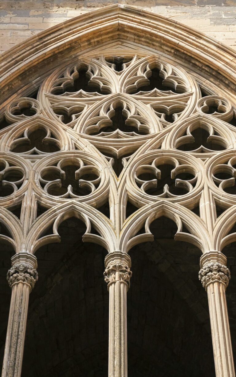 Detailed view of ornate gothic architecture in Lleida Cathedral, showcasing intricate stone carvings and arches.